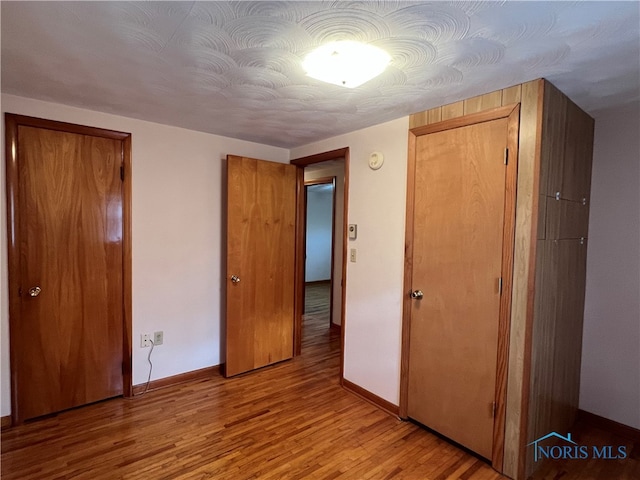 unfurnished bedroom with light hardwood / wood-style flooring