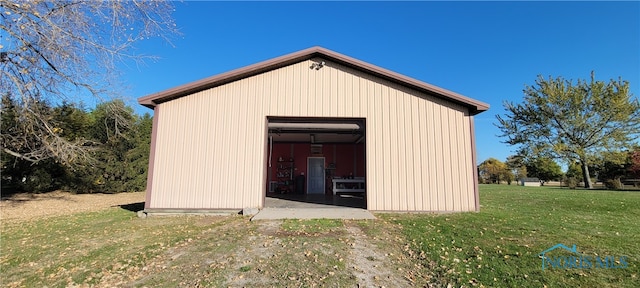 view of outbuilding featuring a yard