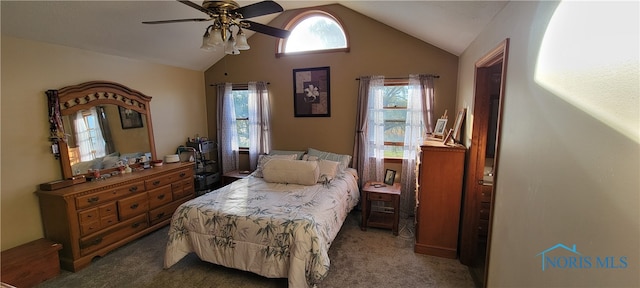 bedroom with vaulted ceiling, carpet flooring, and ceiling fan