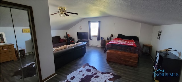 bedroom featuring ceiling fan, a textured ceiling, vaulted ceiling, and dark hardwood / wood-style floors