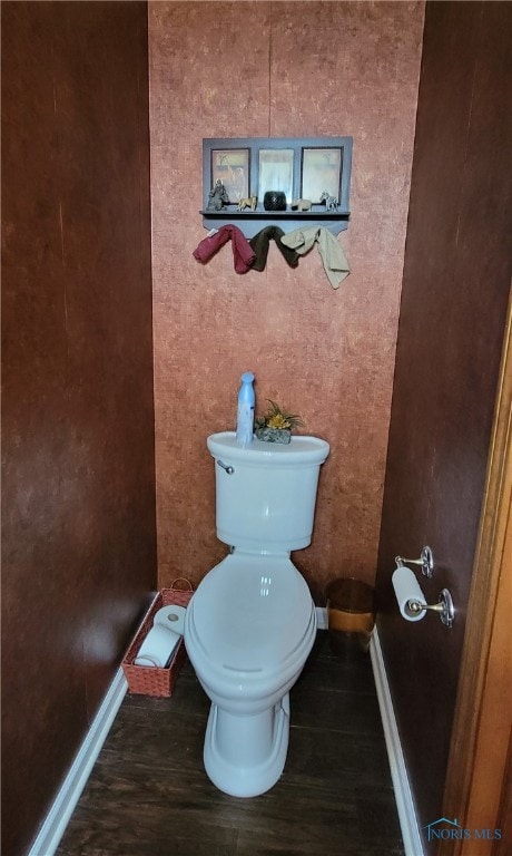 bathroom featuring toilet and hardwood / wood-style floors