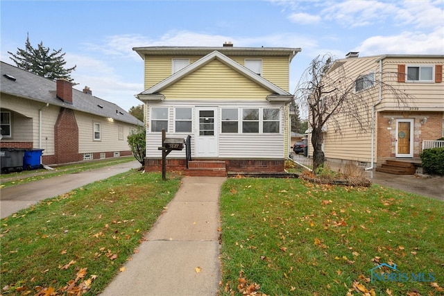 view of front property with a front lawn