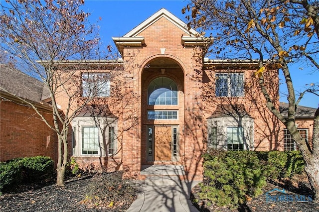 traditional home with brick siding