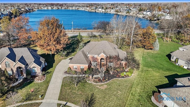 aerial view with a residential view and a water view