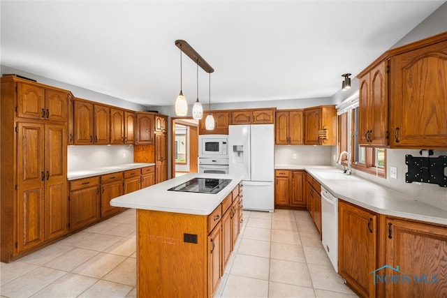 kitchen featuring light tile patterned flooring, pendant lighting, sink, white appliances, and a center island