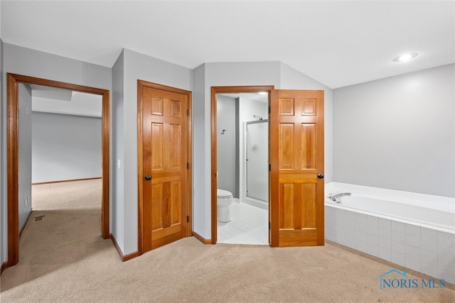 interior space featuring toilet and plus walk in shower