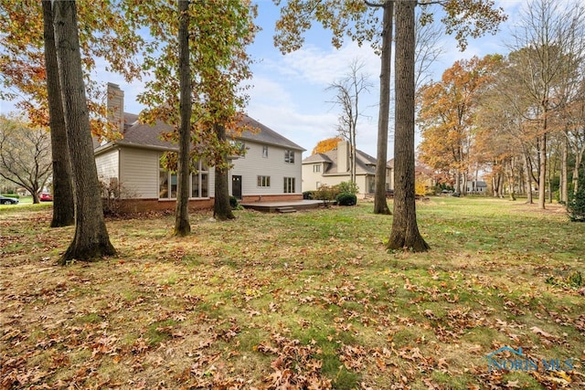 view of yard featuring a wooden deck