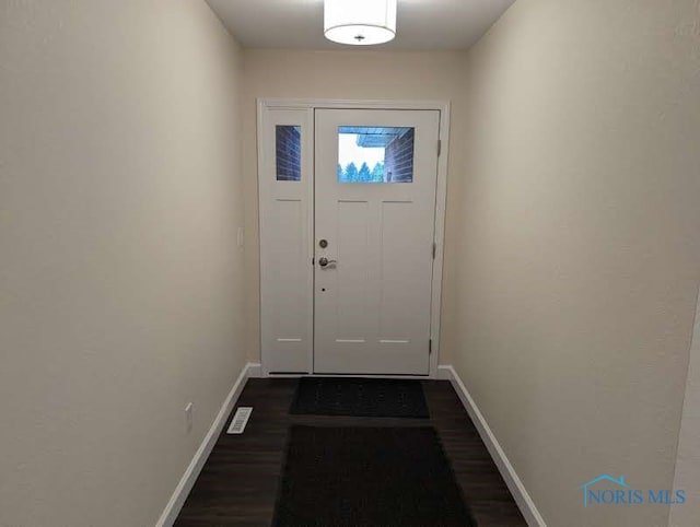 doorway with dark hardwood / wood-style flooring