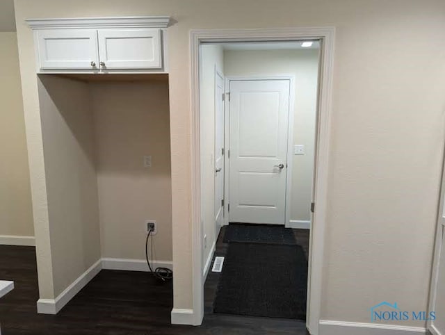 interior space with dark hardwood / wood-style floors