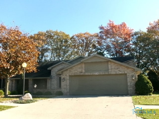 single story home with a garage