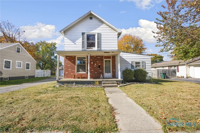 view of front of property with a porch and a front yard