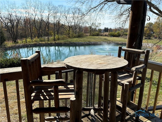 wooden deck with a water view