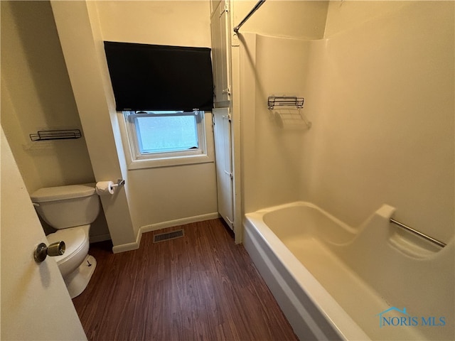 bathroom featuring hardwood / wood-style flooring and toilet