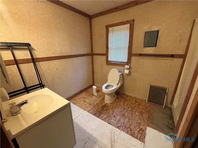 bathroom with tile patterned floors, vanity, and toilet