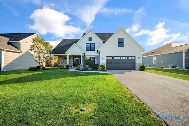 modern farmhouse featuring a garage, a front lawn, and a porch