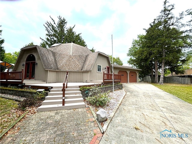 view of front of property with a garage