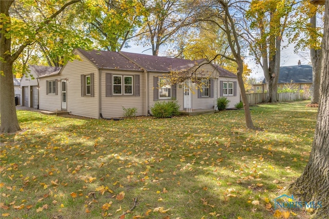 single story home featuring a front yard