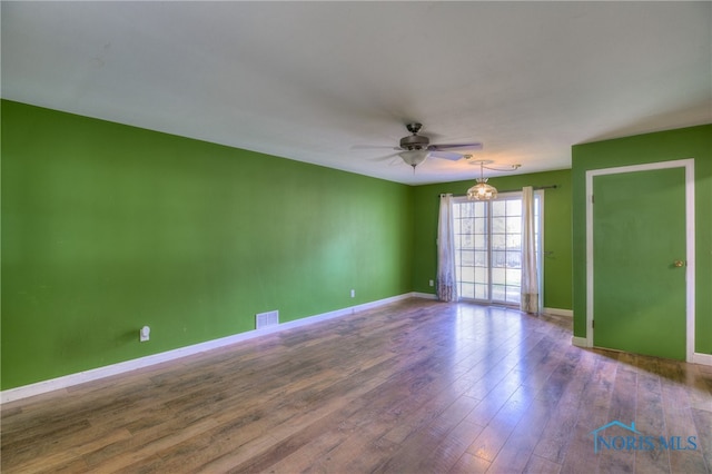 unfurnished room featuring hardwood / wood-style floors and ceiling fan