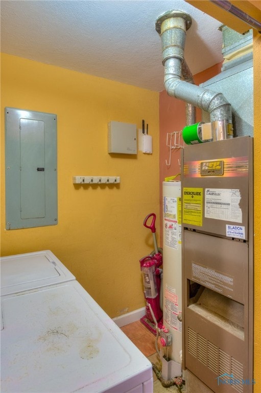 laundry area with electric panel, heating unit, separate washer and dryer, and gas water heater