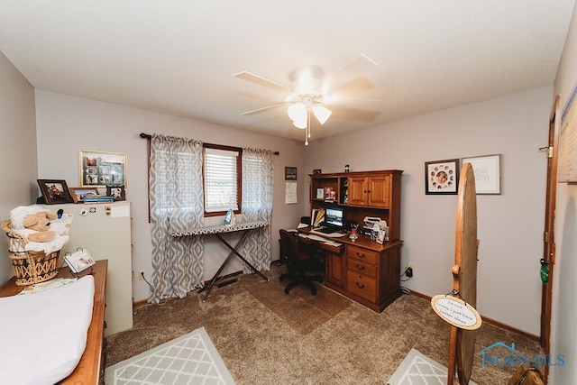 office area with carpet and ceiling fan