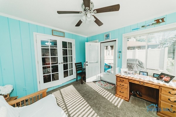 interior space with french doors, ceiling fan, a closet, and crown molding