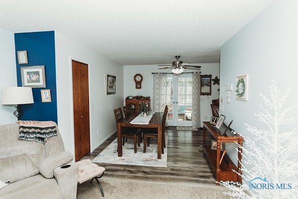 dining area featuring french doors, ceiling fan, and dark hardwood / wood-style flooring