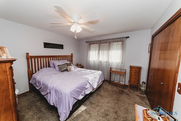 carpeted bedroom with a closet and ceiling fan