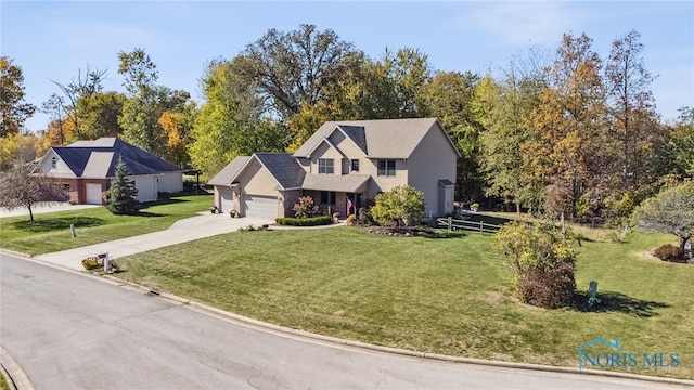 view of front of property featuring a garage and a front lawn