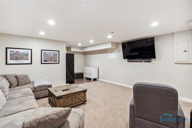 living room featuring electric panel and carpet floors