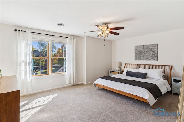 bedroom featuring light colored carpet and ceiling fan