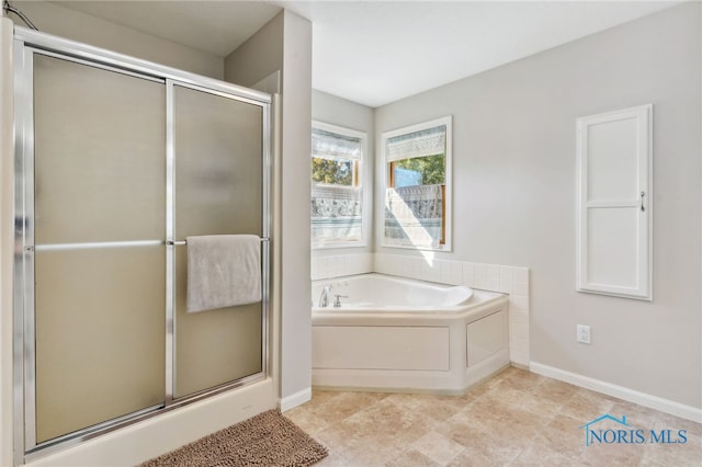 bathroom with shower with separate bathtub