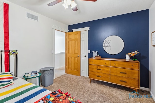 carpeted bedroom with ceiling fan