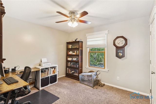 office with light carpet and ceiling fan