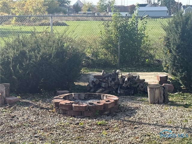 view of yard with an outdoor fire pit