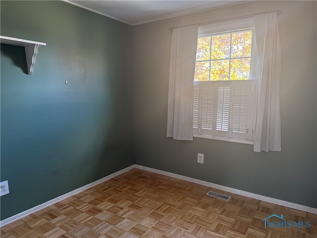 empty room with light parquet flooring