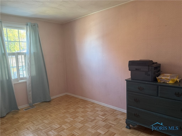 spare room featuring light parquet floors