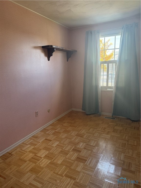 empty room with light parquet floors