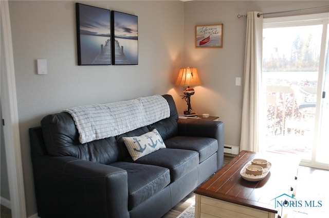 living room featuring light hardwood / wood-style floors and baseboard heating