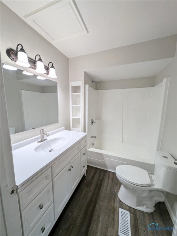 full bathroom with vanity, shower / tub combination, wood-type flooring, and toilet