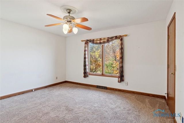 carpeted empty room with ceiling fan