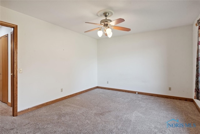 carpeted empty room with ceiling fan