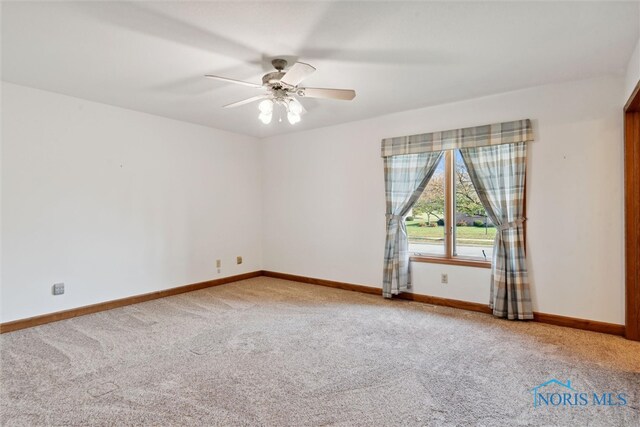 carpeted empty room with ceiling fan