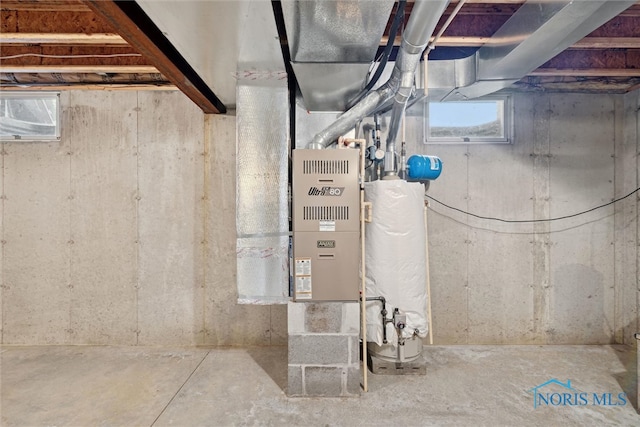 utility room featuring water heater