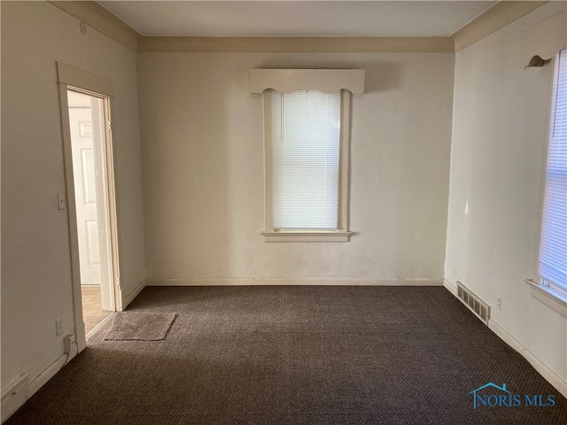 unfurnished room featuring carpet floors