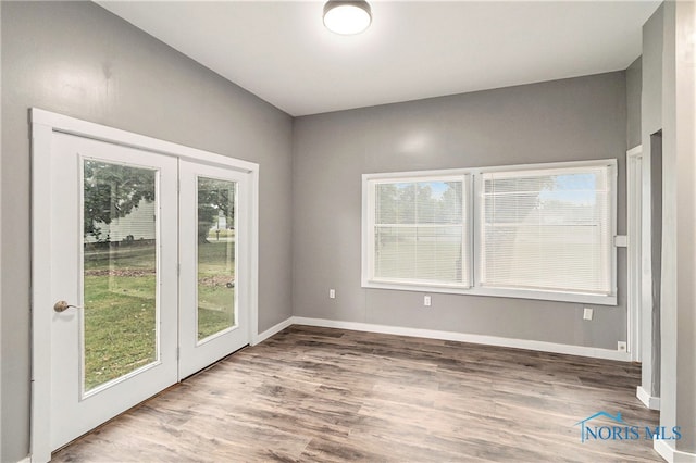 empty room with hardwood / wood-style flooring