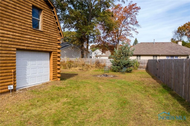 view of yard with a garage