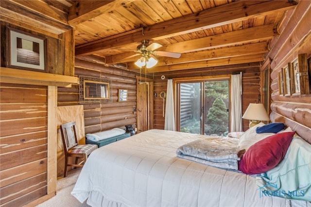 carpeted bedroom featuring wood ceiling, access to exterior, beam ceiling, rustic walls, and ceiling fan