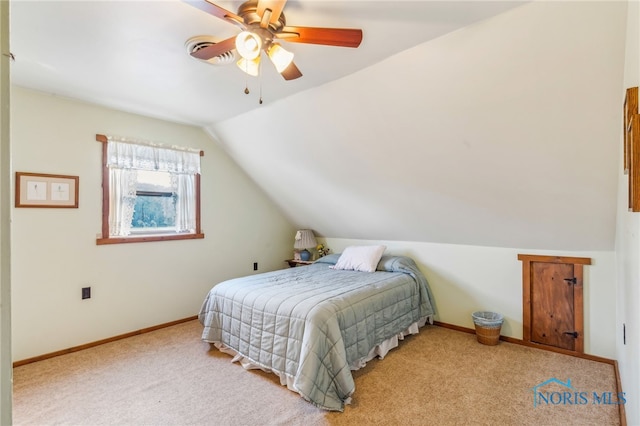 bedroom with lofted ceiling, light carpet, and ceiling fan