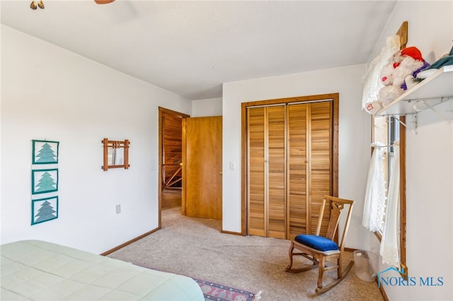 carpeted bedroom featuring a closet