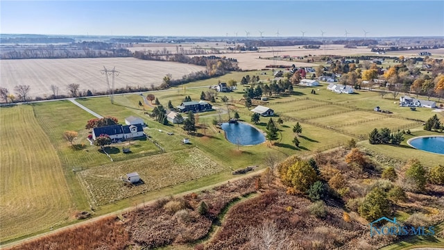 bird's eye view with a water view and a rural view